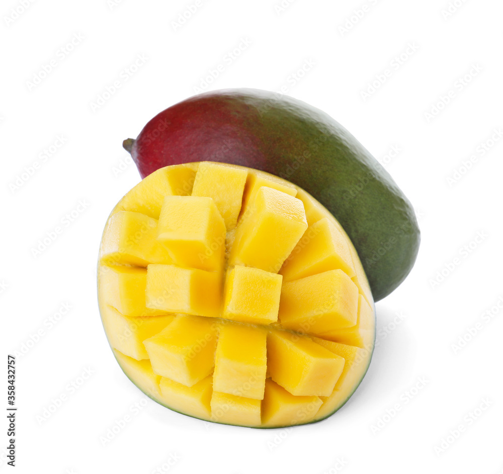 Cut and whole ripe mangoes isolated on white Cut and whole ripe mangoes isolated on white