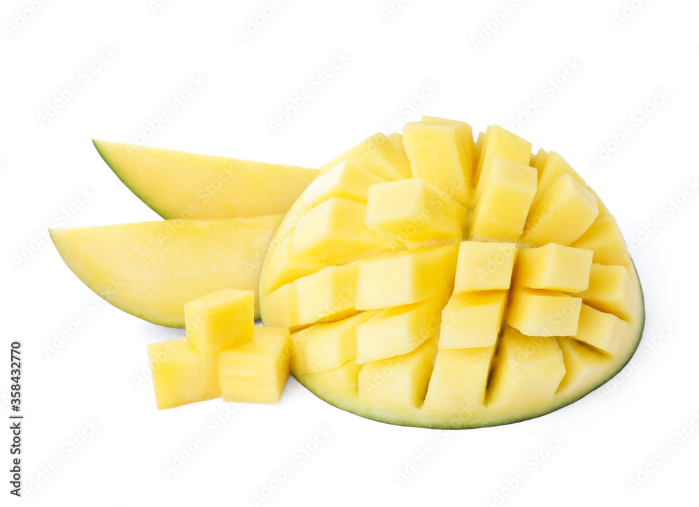 Delicious ripe mango cut into cubes and slices isolated on white