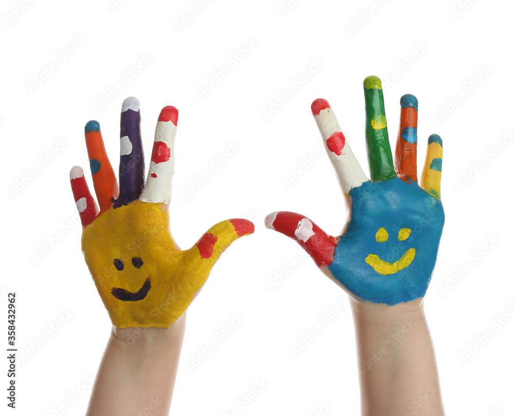 Fototapeta premium Kid with smiling faces drawn on palms against white background, closeup