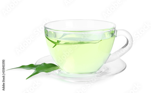 Cup of aromatic green tea and leaves isolated on white