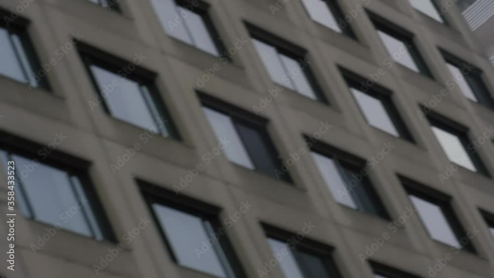 MONTREAL, CANADA - MARCH 14 2019 Angled traveling tracking shot from victorian old brick lain stone building to modern concrete office tower. MONTREAL, CANADA - MARCH 14 2019 Angled traveling tracking shot from victorian old brick lain stone building to modern concrete office tower.