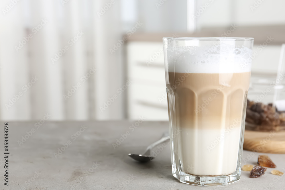 Delicious latte macchiato on grey table indoors, space for text Delicious latte macchiato on grey table indoors, space for text