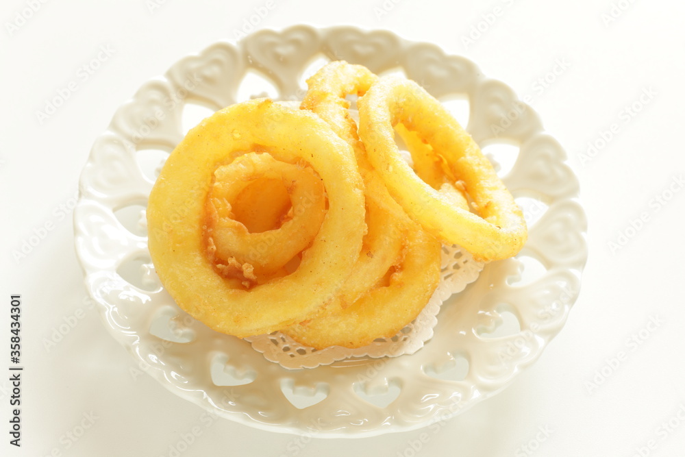 Fast food, onion rings on dish for unhealthy food Fast food, onion rings on dish for unhealthy food