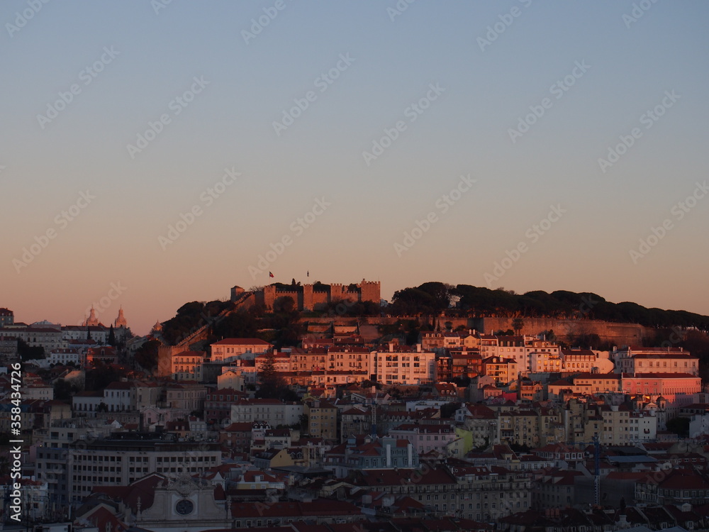 The sunset seen from Miradouro Sao Pedro de Alcantara with a great view, Lisboa, Portugal