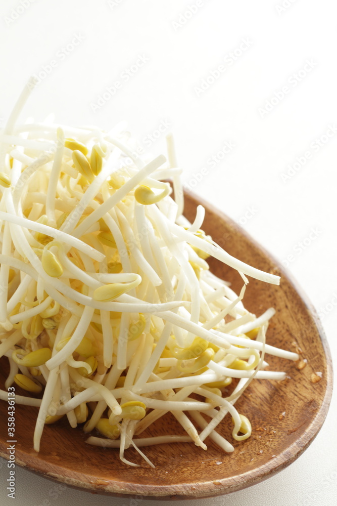 Chinese food ingredient, soy bean on wooden plate Chinese food ingredient, soy bean on wooden plate