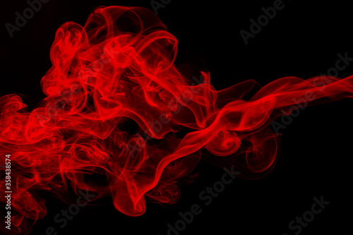 Red smoke on black background, fire design, darkness concept