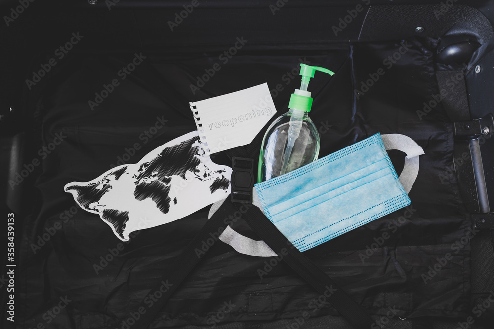 flying during covid19, carryon luggage with surgical face mask for