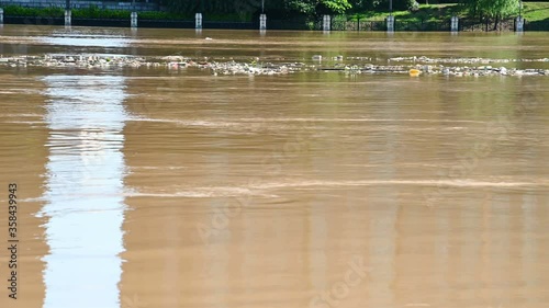 flood with lots of man made trashes floating