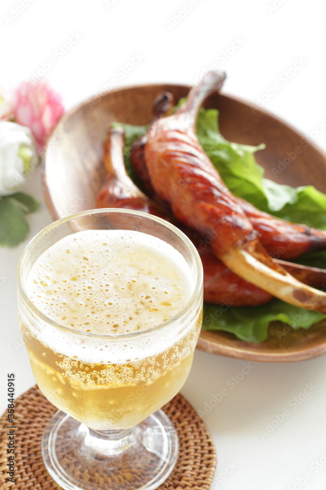 Grilled bone sausage on wooden plate with copy space Grilled bone sausage on wooden plate with copy space