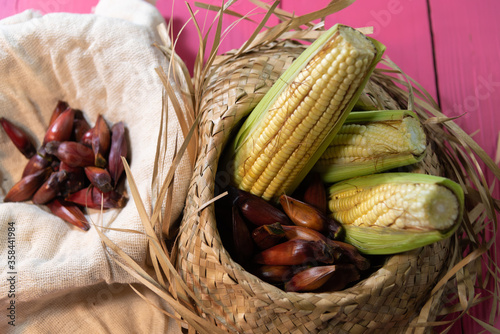 Straw hat with pine nuts and green corn for São João party in Brazil photo