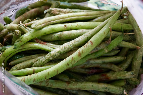 Close up of rotten green beans in a pile
