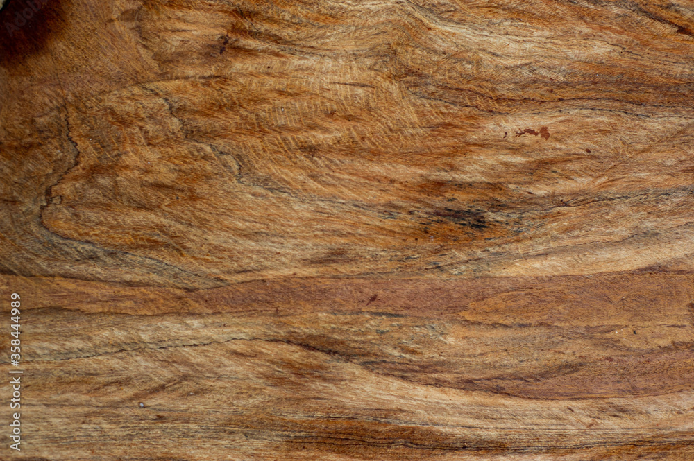 Fototapeta premium The background of the wooden panels with beautiful exotic patterns.