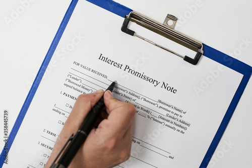 Filling and signing Interest Promissory Note document photo