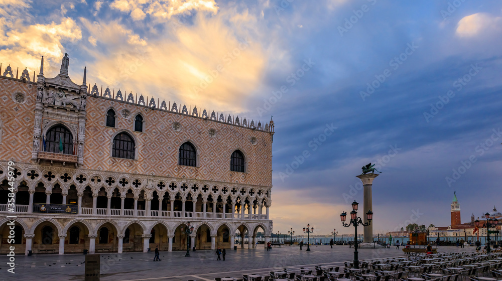 Doge's Palace and Saint Mark column of the Lion at Saint Mark's San Marco square by Grand Canal Venice, Italy at sunrise