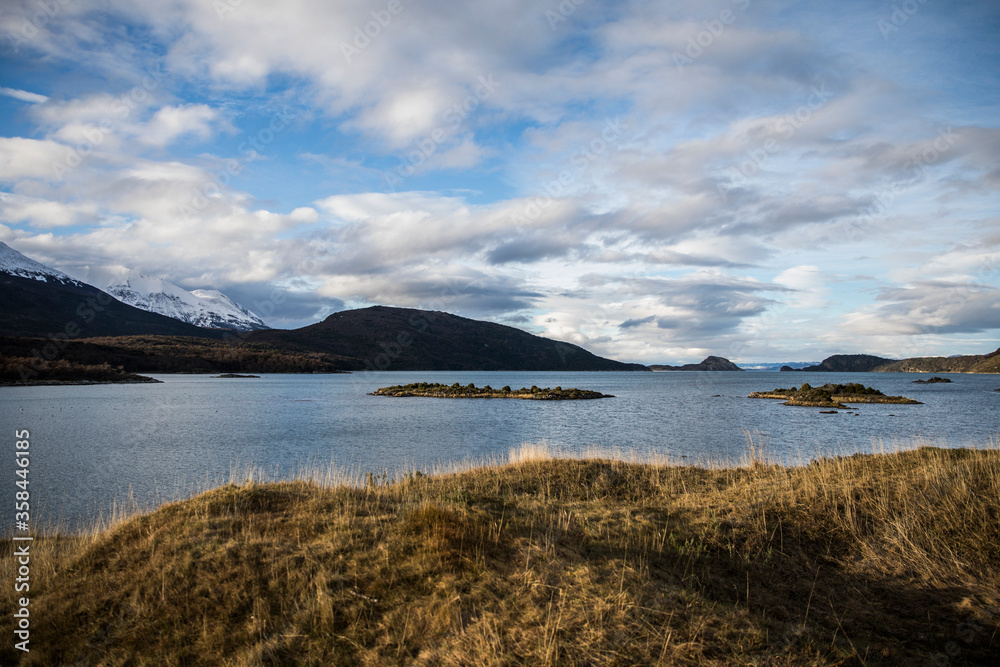 Landscape of ocean with mountain in the back Landscape of ocean with mountain in the back