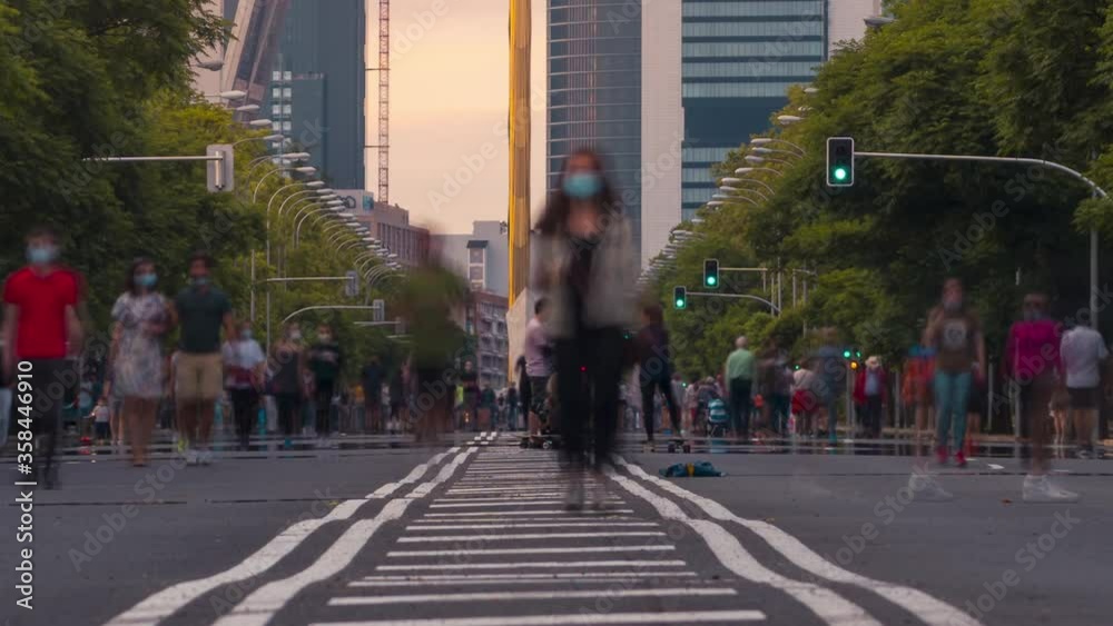 Close up Time lapse of Paseo de la Castellana in Madrid, Spain. People walking on the street covid 19. No cars in this major street because of Coronavirus outbreak. Close up Time lapse of Paseo de la Castellana in Madrid, Spain. People walking on the street covid 19. No cars in this major street because of Coronavirus outbreak.