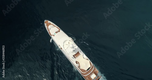 Large superyacht cruising underway in open ocean
