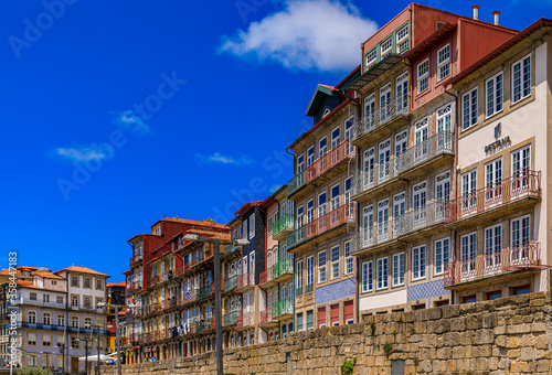 Traditional house facades decorated with Portuguese azulejo tiles in the famous Ribeira neighborhood in Porto, Portugal