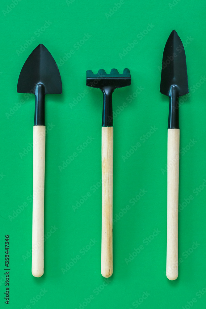 Hand tool for tillage on a green background. Hand tool for tillage on a green background.