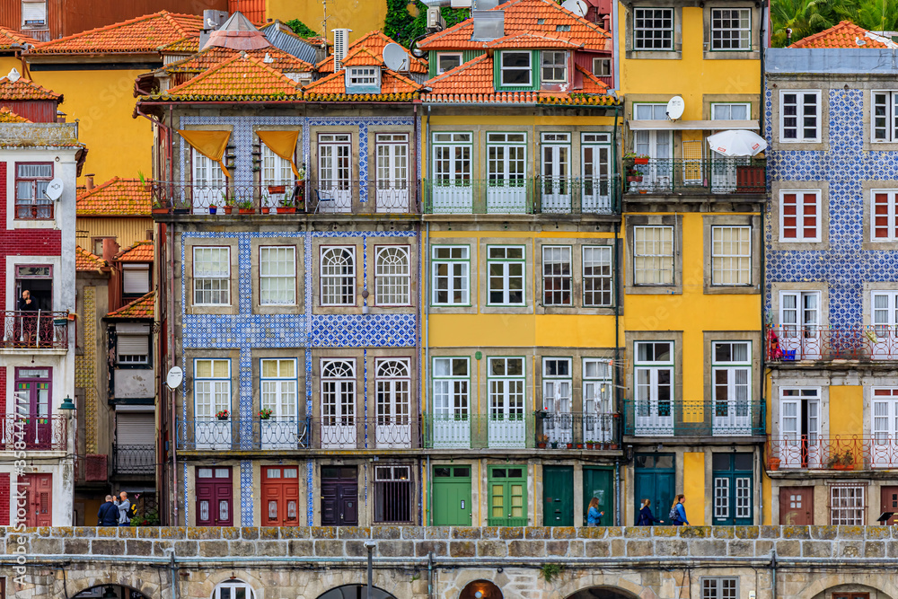 Traditional house facades decorated with Portuguese azulejo tiles in ...