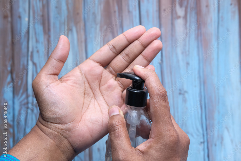 man's hands using hand sanitizer gel, healthcare and medical . man's hands using hand sanitizer gel, healthcare and medical .