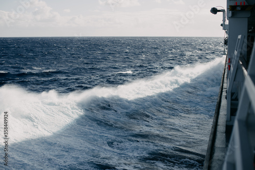 A cruise ship cuts through the waves in the Indian ocean.