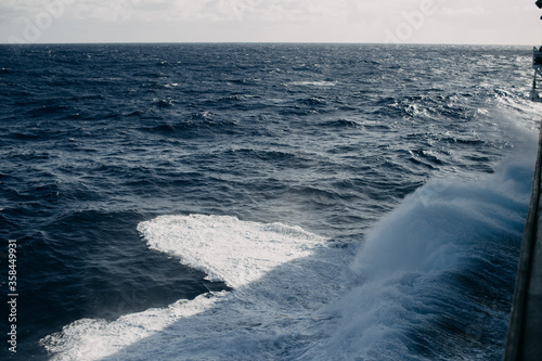A cruise ship cuts through the waves in the Indian ocean.