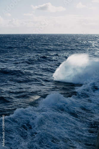 A cruise ship cuts through the waves in the Indian ocean.