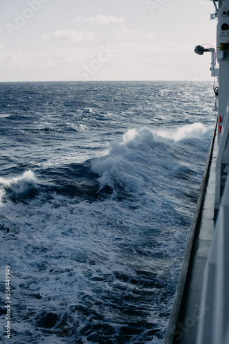 A cruise ship cuts through the waves in the Indian ocean.