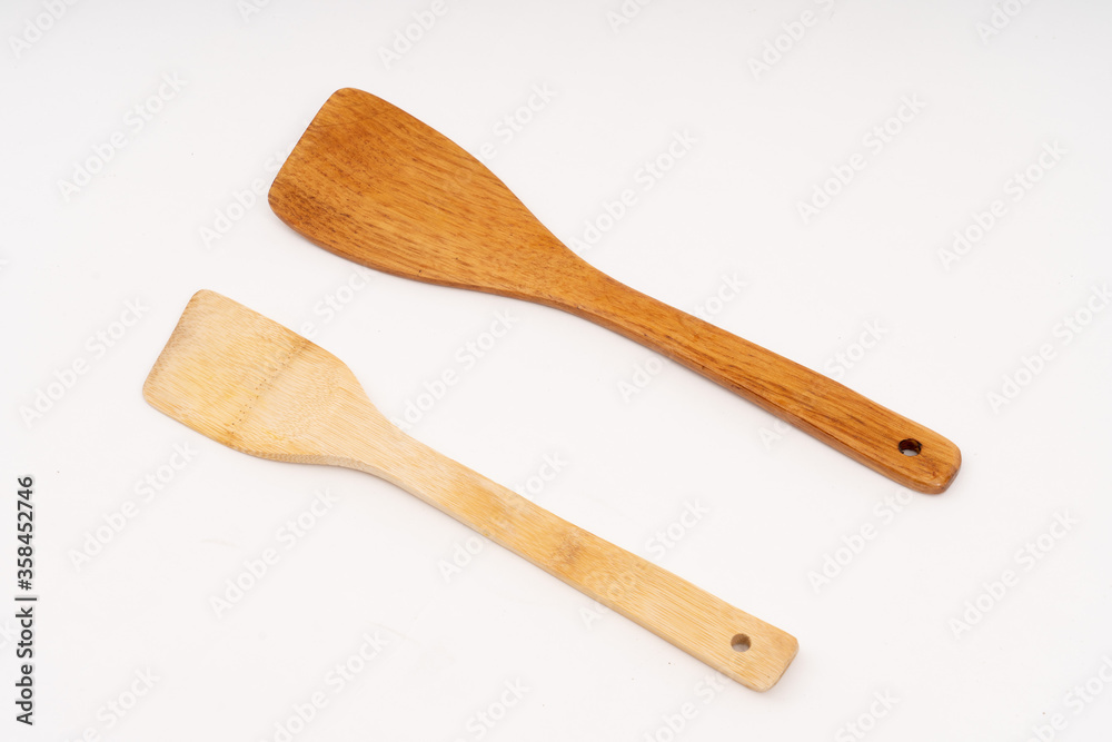 spade of frying pan made from wood on white background selective focus, kitchen flipper spade of frying pan made from wood on white background selective focus, kitchen flipper