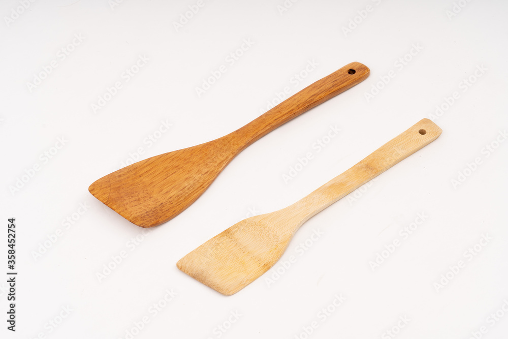 spade of frying pan made from wood on white background selective focus, kitchen flipper spade of frying pan made from wood on white background selective focus, kitchen flipper
