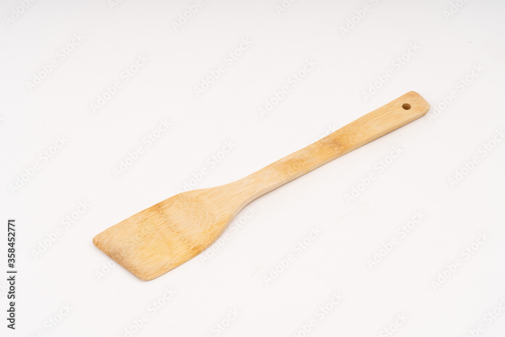 spade of frying pan made from wood on white background selective focus, kitchen flipper spade of frying pan made from wood on white background selective focus, kitchen flipper
