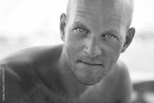 Black&white portrait of Scandinavian bald man with bright eyes