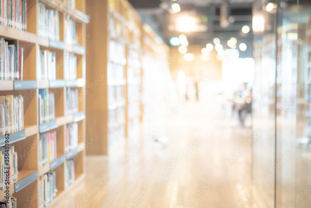 Abstract blurred public library interior space. blurry room with bookshelves by defocused effect. use for background or backdrop in business or education concepts