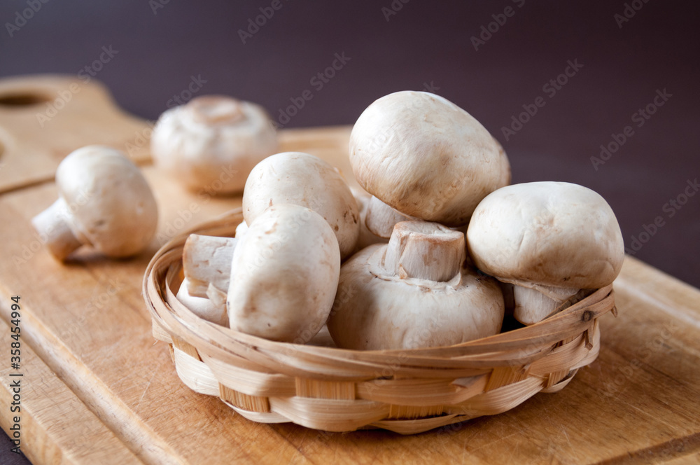 Still life: basket with mushrooms on a cutting Board