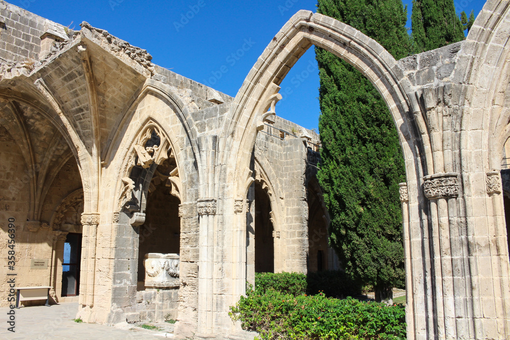 Bellapais Abbey, White Abbey, Abbey of the Beautiful world.Arches and the entrance to the refectory, a fragment of the Salamis sarcophagus, used by the monks as a washroom.