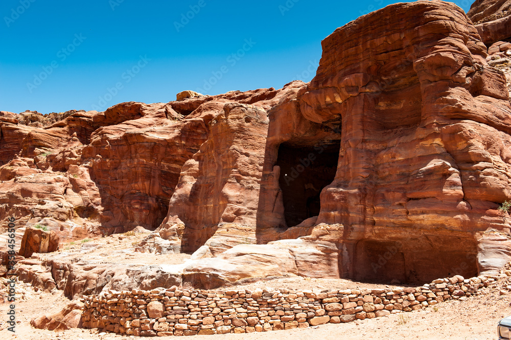 It's Red sandstone rocks in Petra (Rose City), Jordan. The city of Petra was lost for over 1000 years. Now one of the Seven Wonders of the Word It's Red sandstone rocks in Petra (Rose City), Jordan. The city of Petra was lost for over 1000 years. Now one of the Seven Wonders of the Word