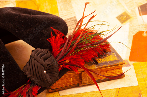 Times past, a book, hat, and letters.