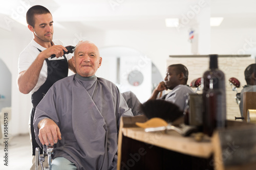 Aged male client getting haircut