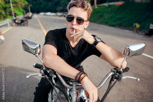  portrait of a guy sitting on a motorcycle 