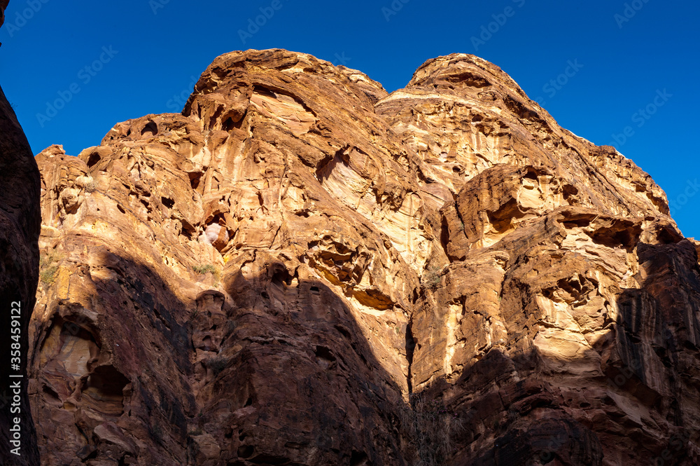 Fototapeta premium It's Canyon in Petra (Red Rose City). The city of Petra was lost for over 1000 years. Now one of the Seven Wonders of the Word