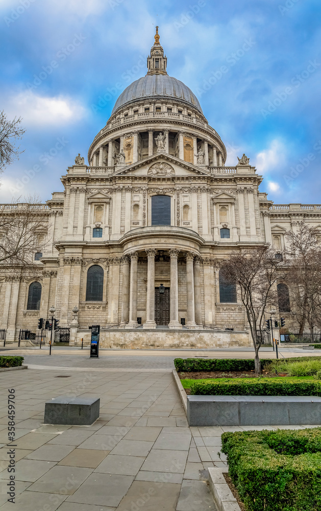 View of the famous St. Paul's Cathedral in city center on a cloudy day in London, England