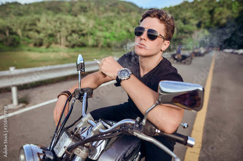  portrait of a guy sitting on a motorcycle 