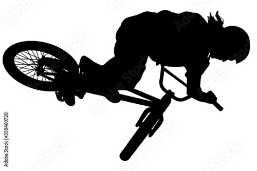 SIlhouette of BMX bike rider doing stunts