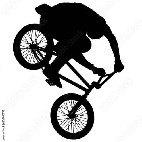 silhouette of a man riding a bike