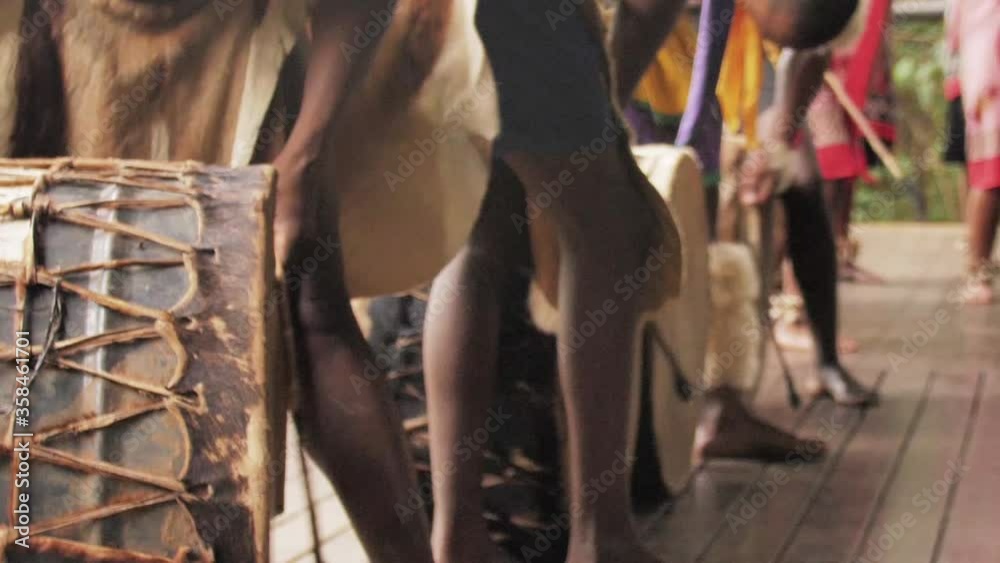 Zulu men playing traditional drums, closeup shot Zulu men playing traditional drums, closeup shot