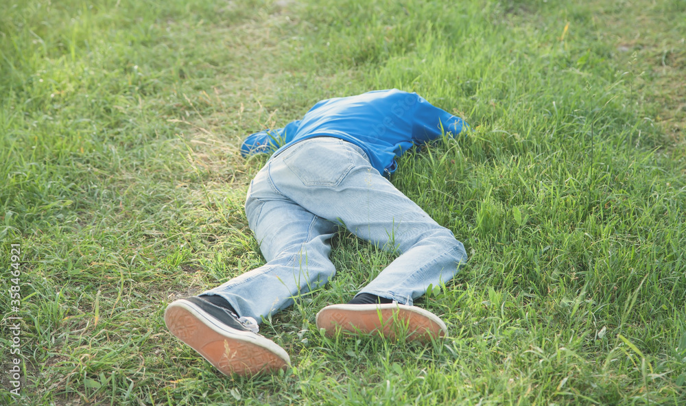 Caucasian unconscious man in outdoors. - obrazy, fototapety, plakaty 