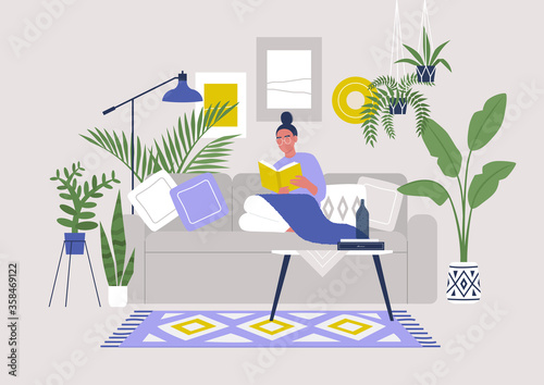 Young female character sitting on sofa and reading a book, cozy boho interior with plants and ethnic decoration, stay at home