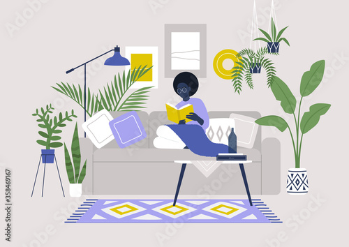 Young black female character sitting on sofa and reading a book, cozy boho interior with plants and ethnic decoration, stay at home