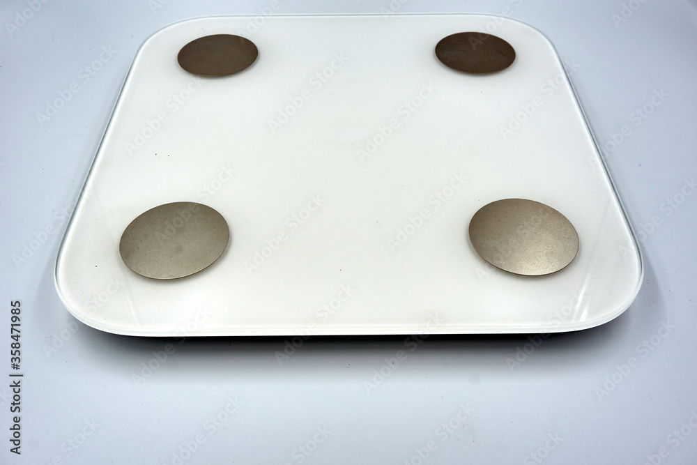 White digital weigh scale over white background White digital weigh scale over white background